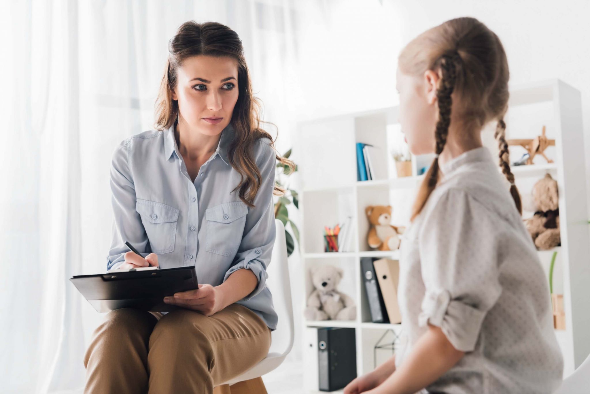 Photo of woman counselor with child